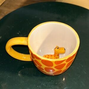Giraffe mug kids. Little giraffe inside. Giraffe print on outside. Like new